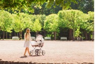 mom strolling with baby