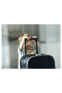 baby pushing a suitcase