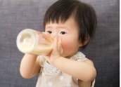 baby drinking from a bottle