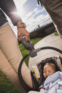 Dad carrying infant carrier with Lugbug handle