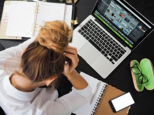 woman doing breast pump research on computer