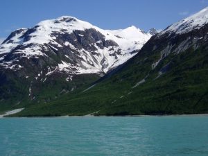 snow capped mountains and water