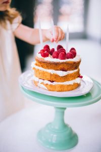 birthday cake with raspberries on top, children's birthday party