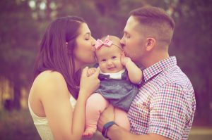 loving couple with new baby