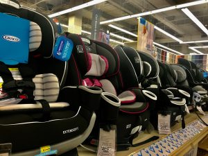 convertible car seats lined up in a row at BuyBuyBaby--baby essentials
